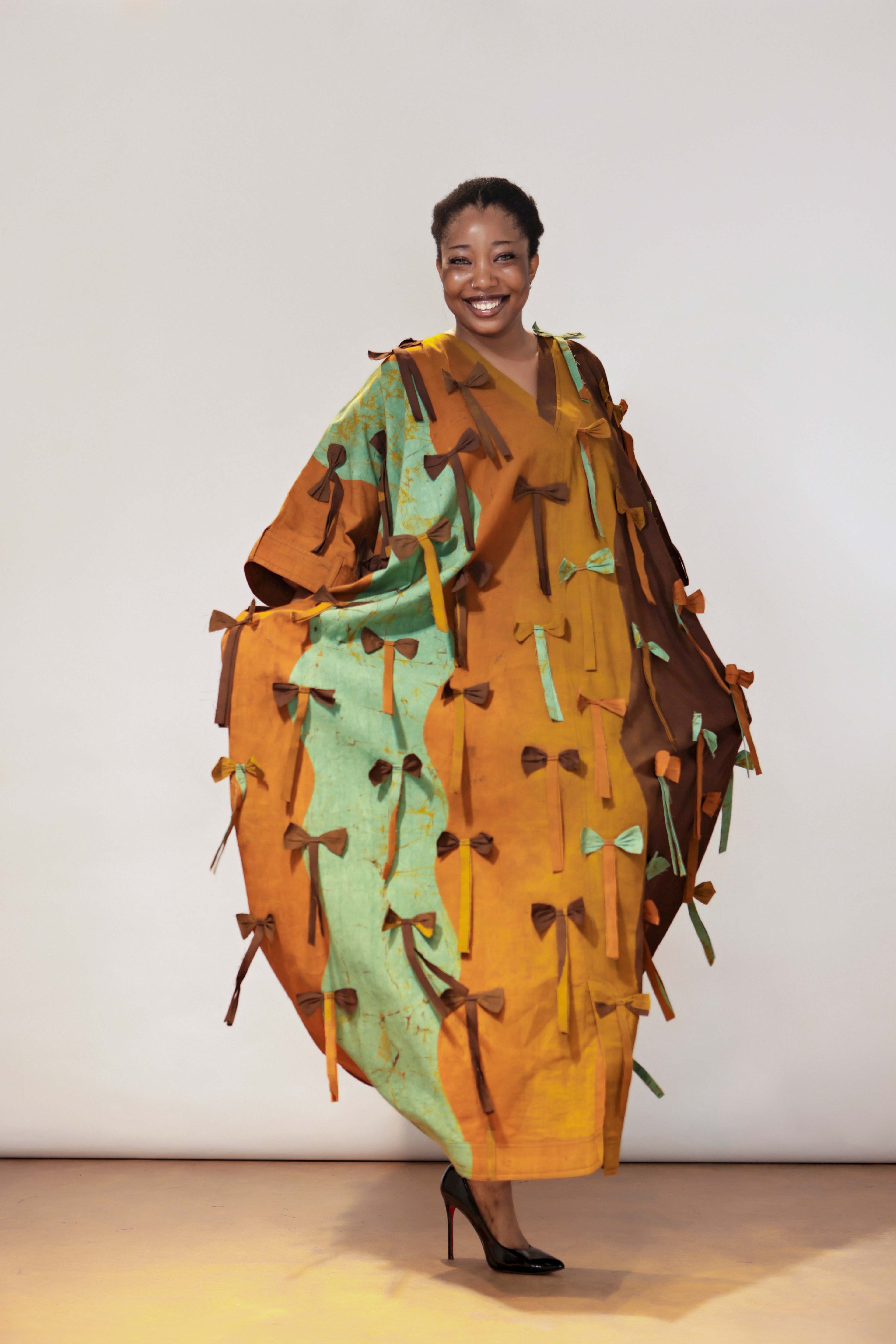 The Full Length bow Detail, Belt hole Hem and Sleeves Agbada