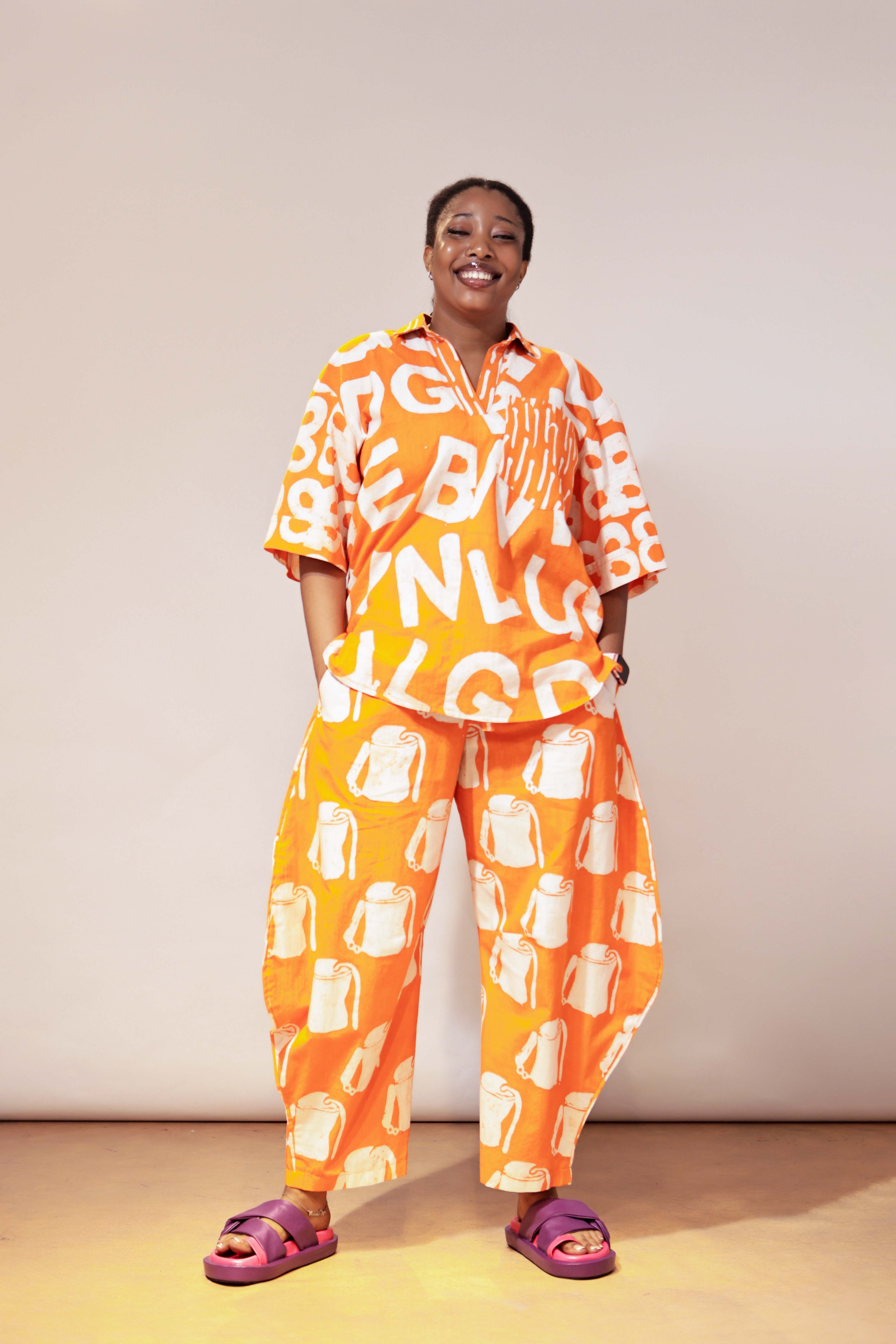 The Mix Print Ajiun Kembe horseshoe Pant Set in stunning Orange