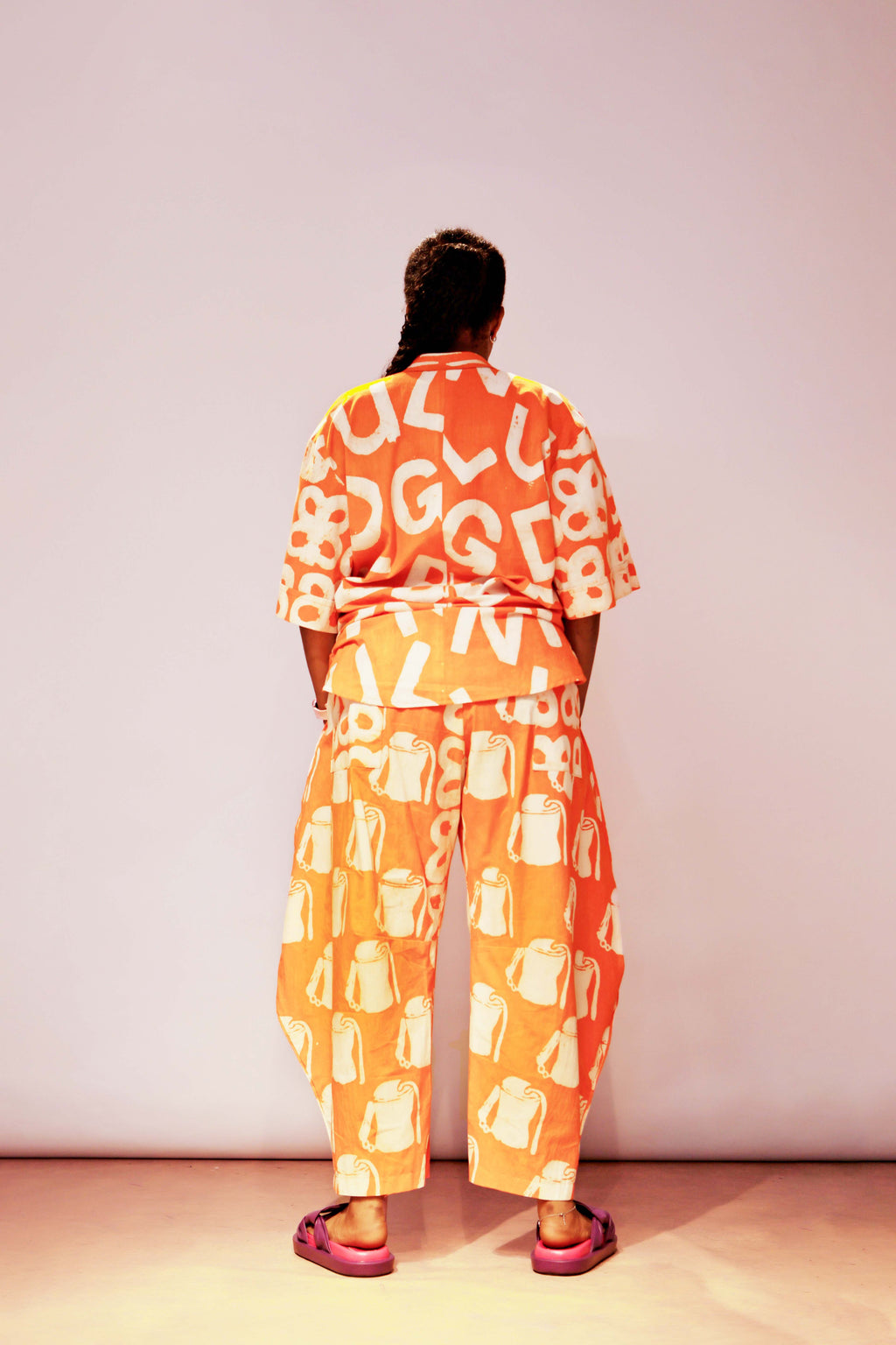 The Mix Print Ajiun Kembe horseshoe Pant Set in stunning Orange